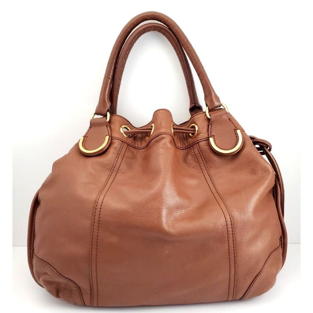cognac leather gold hardware Juicy Couture Drawstring Hobo Shoulder Bag